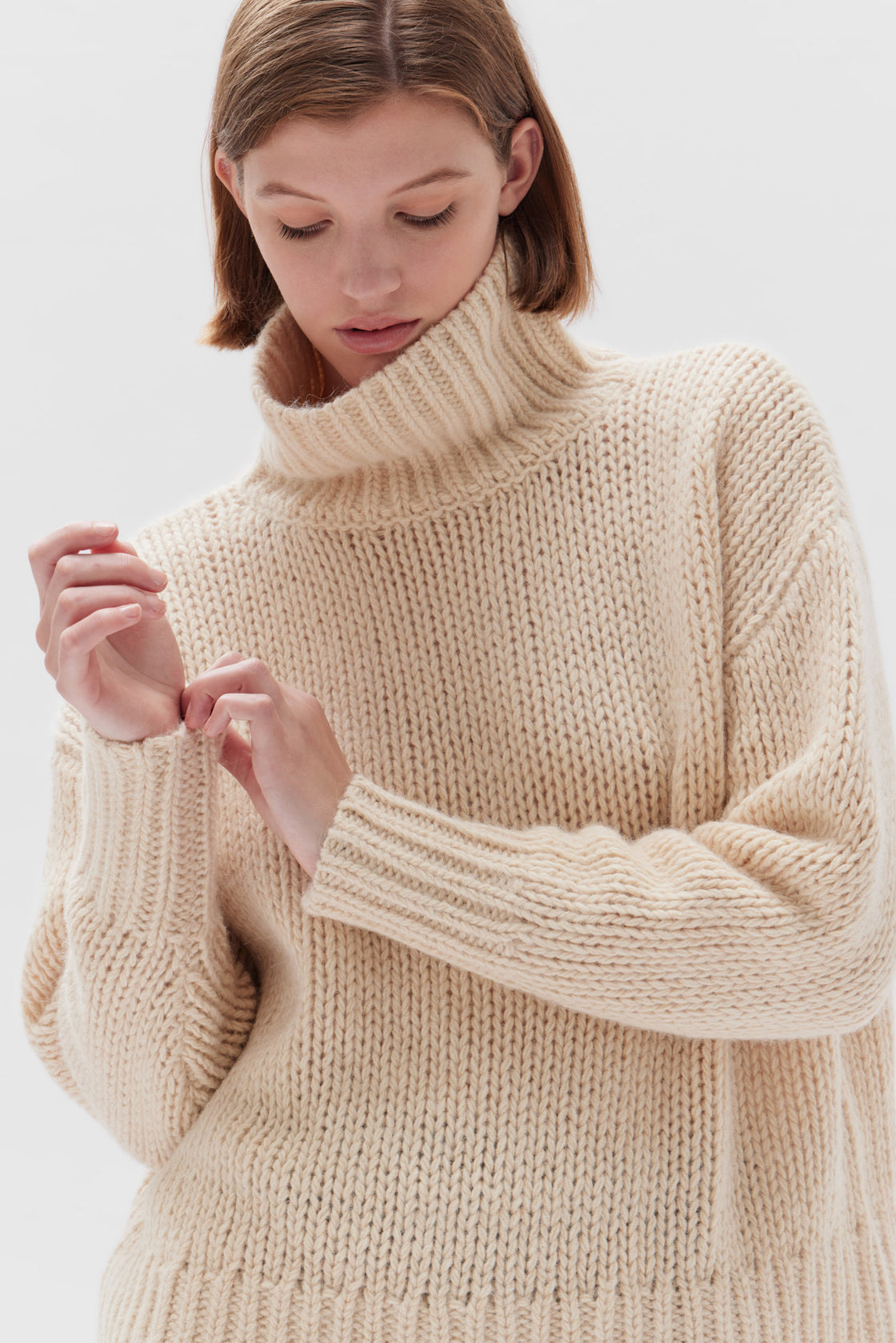 Assembly label clearance roll neck knit